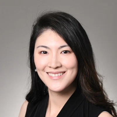 Emily Chen, smiling in a black shirt.